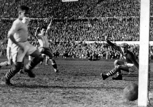 Argentina's Guillermo Stabile slots the ball past American goalkeeper Jim Douglas Argentina's Guillermo Stabile slots the ball past American goalkeeper Jim Douglas